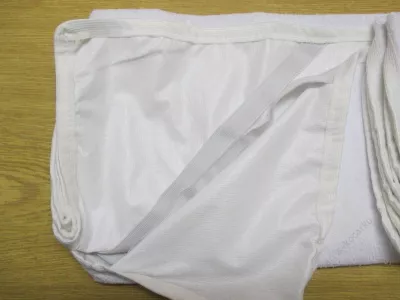 Podložka pod prostěradlo 120 x 60.
