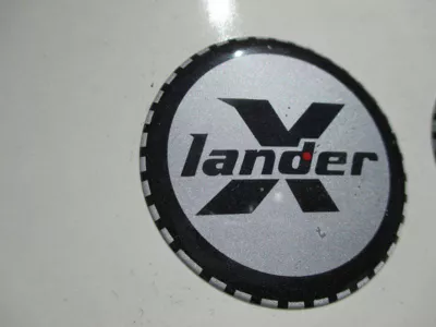Nálepka kulatá X - lander.